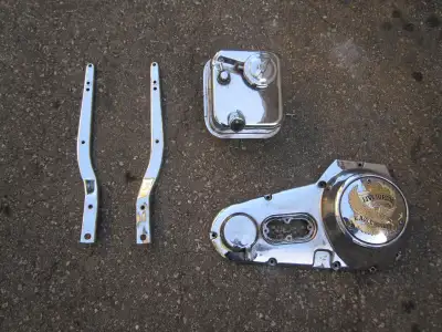 1970-84 chrome outer primary cover with "Live to Ride" derby cover FLH or FX - $250 Oil tank - $120...