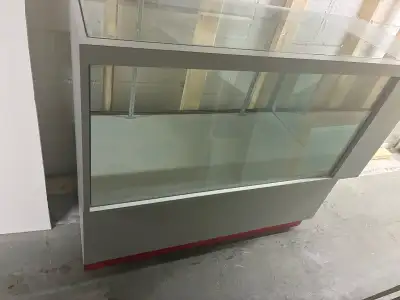 Glass cabinet, decent size, fair condition. Est 4-5 feet wide, 3-4 feet high. Has storage underneath