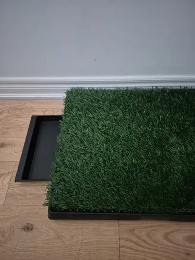 Brand new fake grass pad with drain tray