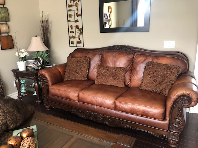 Ashley Furniture real leather sofa with wood accent p/u Aspen SW | Couches  & Futons | Calgary | Kijiji