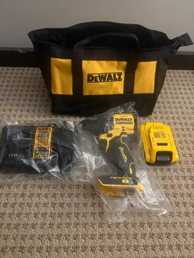 This brand new DEWALT 20V Max Brushless Drill Kit includes the high-performance drill, battery, char...