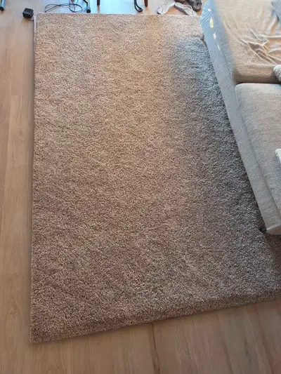 IKEA STOENSE rug, offering a soft and low pile in a neutral beige tone, sized at 170x240 cm (5' 7" x...