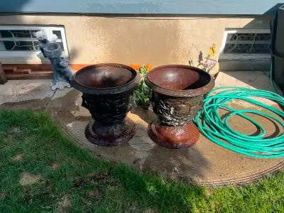 Two Decorative Cast Iron Flower Pots for sale. Very large and heavy. Will require two people to move...