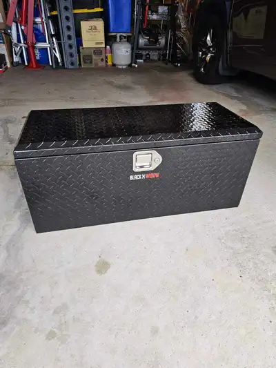 This is a Black Widow truck box. It's black diamond plate aluminum. This item is brand new and was n...