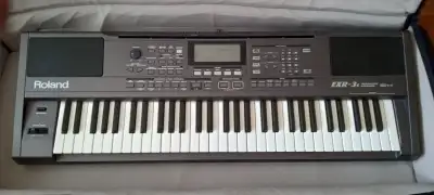 The classic and very popular 61 key Roland EXR-3s Arranger keyboard with soft case, stand and Behrin...