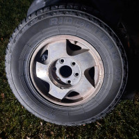 Pair of 245/75R16 Tires on GM Rims