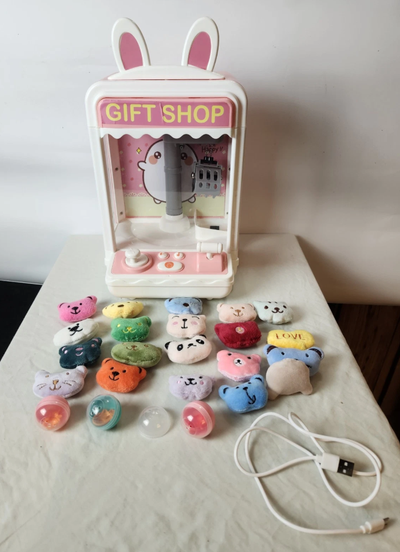 Home claw machine game, great for kids. Comes with mini prizes as shown. Tested and works with music...