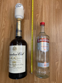 Extra large Canadian Club and Smirnoff bottles.