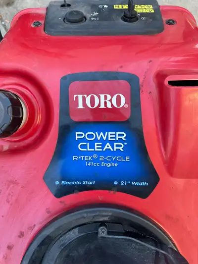 Used Toro Power Clear snowblower with a 141cc 2-cycle engine and a 21-inch clearing width. Manual st...