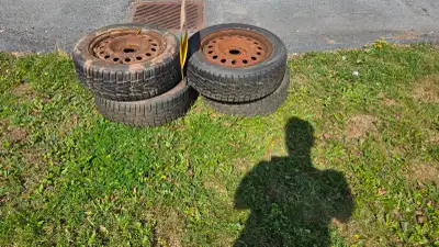 Winter tires on steel wheels used for one season. Stored outside.