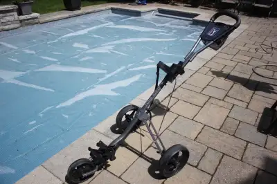 PGA Tour Edition push cart. Large, padded handle. Mesh bag holder. 3 x 11 inch wheels. Wheel brake....