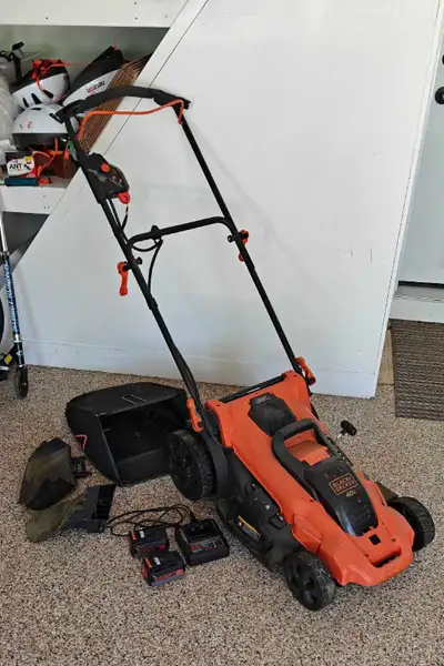 Black & Decker 18" electric mower, comes with bag, chutes, 2 batteries and charger. Sufficient for a...