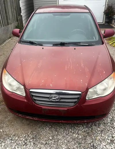 This 2009 Hyundai Elantra sedan features an automatic transmission and is powered by a reliable gaso...