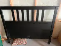 IKEA Malm Full size bed with rolling drawers.