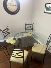 Round glass table and 4 chairs 