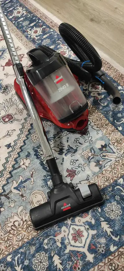 Selling a Bissell Zing II bagless canister vacuum in red. It is in mint condition It's in great shap...