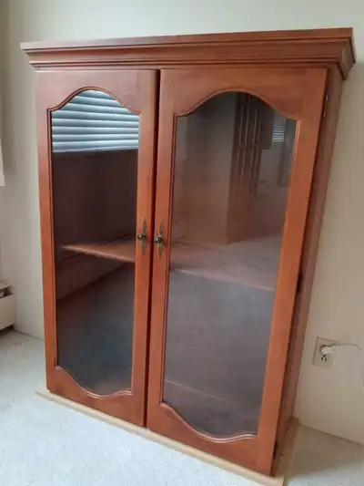 This Solid Maple China Cabinet has 2 Glass Doors and 3 Shelves Inside Measures, 52inches Tall, 40 in...