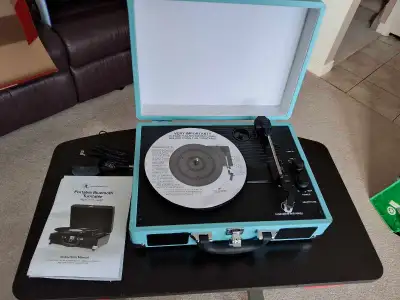 A portable suitcase style turntable. It is in like new condition, I used it for playing a total of 2...