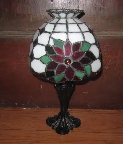 Beautiful Tiffany style candle powered lamp. Nice smaller size, but quite heavy. Real stained glass...