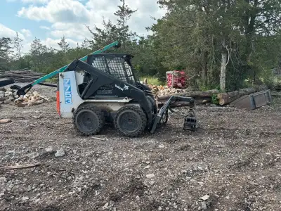 Bob cat skid steer great machine used daily Comes with Bucket Forks Air tires Solid tires which are...