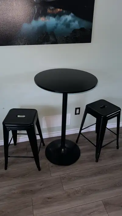 pub table and two metal stools, View more