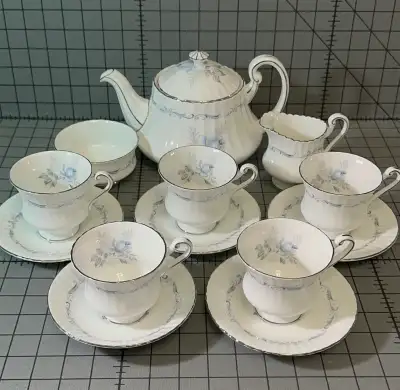 Beautiful vintage tea set. Has a teapot, creamer, sugar bowl, , View more