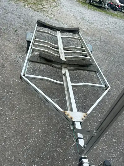 11 ft 6 inch by 5 ft 9 Aluminum trailer. Could use it for any thing, tires bearing and rear lights a...