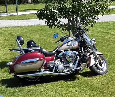 Kawasaki Vulcan Nomad 1700 CC beautiful Metallic red in gold accented by Chrome front windshield ant...