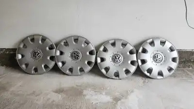 Refresh the look of your vehicle with this set of four pre-owned Volkswagen Jetta wheel caps designe...