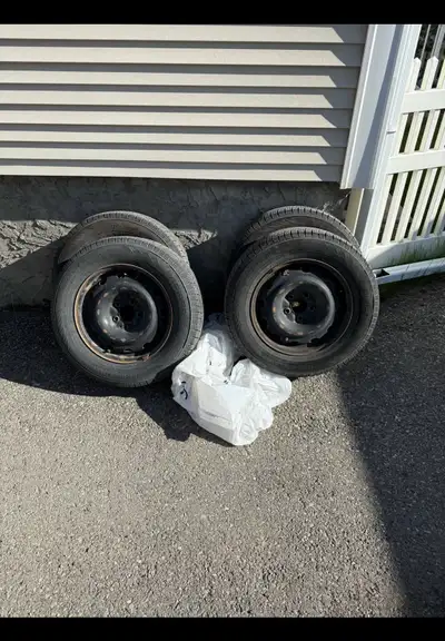 Nokian 4 All-Season M+S Tires WITH Rims Treads between 8 and 9 out of 32, taken out from Honda Odyss...