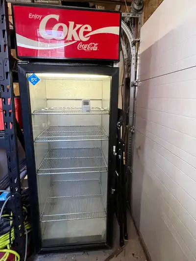 Brighten up your garage, games room, or man cave with this Coca-Cola branded commercial fridge! This...