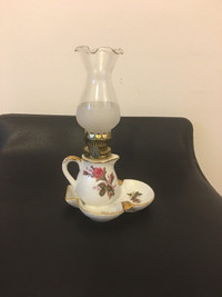 Vintage small oil lamp with ashtray. 8”tall with chimney.