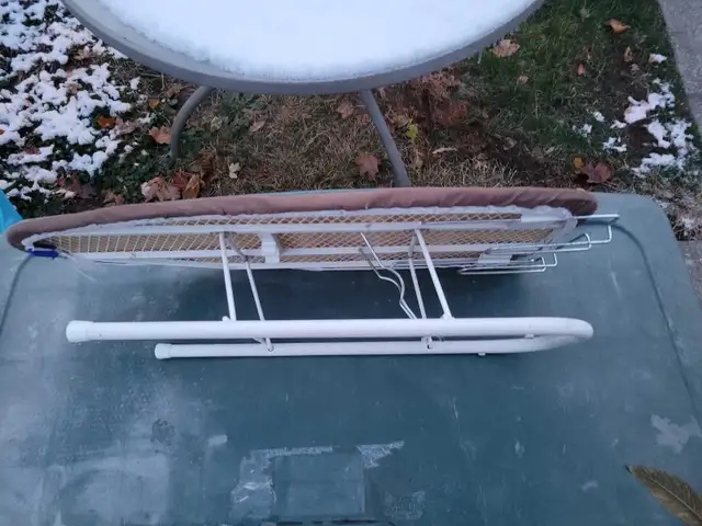 Folding table top ironing board.64385361796099122