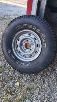 31 x 10.5/15 All-terrain tire on rim