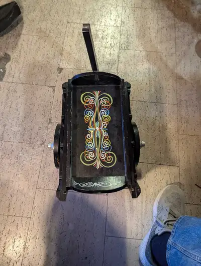 This charming, wooden cart features hand-painted designs, adding a whimsical touch to any space. Its...