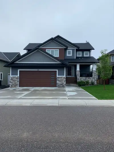 2402 sq foot fully developed 2 story walkout on a 60 by 125 ft lot fully landscaped and custom built...
