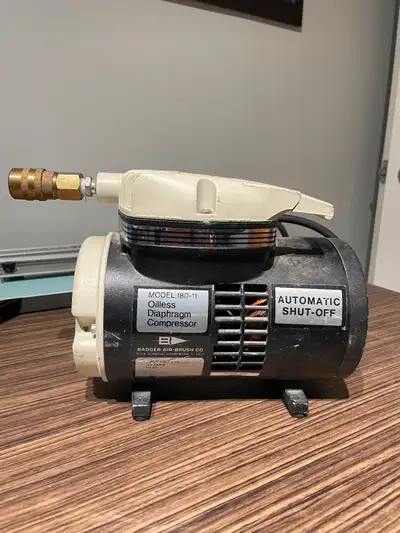 Badger air compressor for airbrushing or anywhere a small portable compressor is needed.