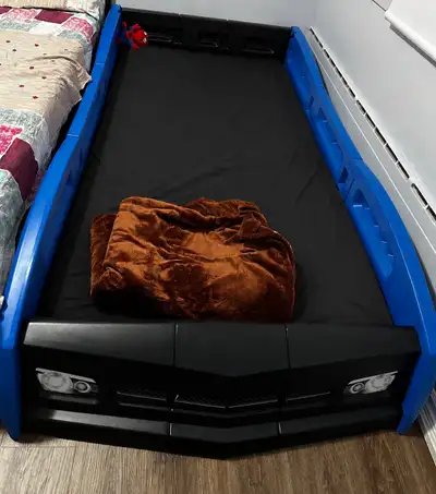 Kids car bed, hardly used for 50 days in a year Can be dis-assembled for easy pick up.