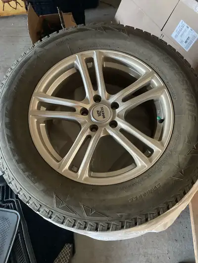 Bridgestone Blizzak winter tires (235/65R17) with rims. Good tread.