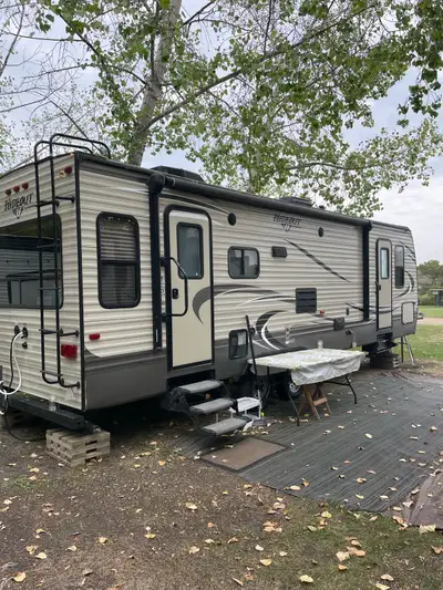 Couples trailer rear living room excellent condition, upgraded Beautyrest Queen mattress. Everything...