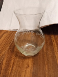 Glass vase with nice design around bottom of vase. 3" round.