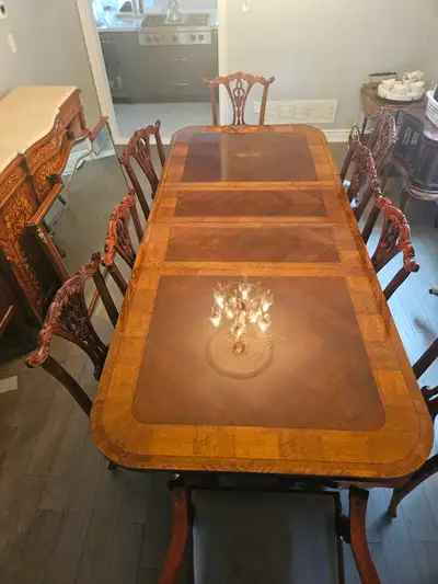 A complete dining room anchor—double-pedestal table (72” closed, extends to 102”) with 12 matching C...