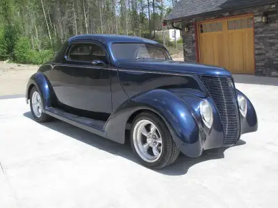 Downs 2 door coupe fiberglass body, Heidts front end with disk brakes, Power steering, Ford rear end...