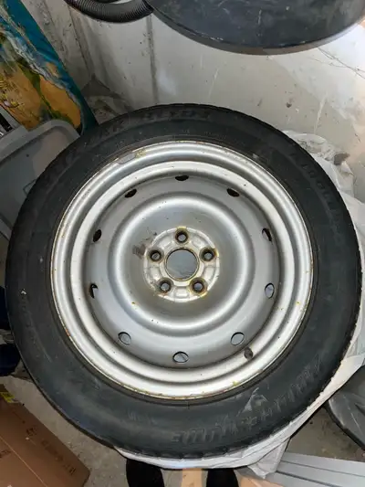 205/55R16 Bridgestone Blizzaks, steel rims, 3 are silver and one is black. Two of the tires have bas...