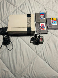 NES with hook ups with one controller and 3 games