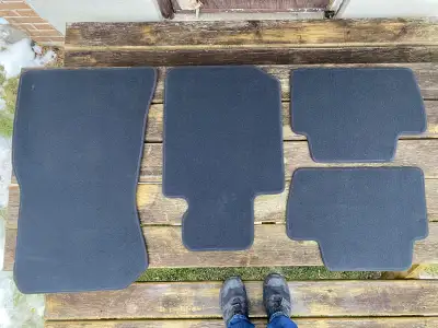 The OEM original carpet car mats from a 2017/2021 BMW M240i. Never been used because I bought rubber...