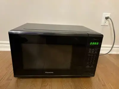 This is a used Panasonic microwave oven in good working condition, perfect for quick meals and rehea...