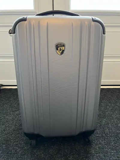 This is a new Heys carry-on size suitcase, perfect for travel. It features a durable hard shell, smo...