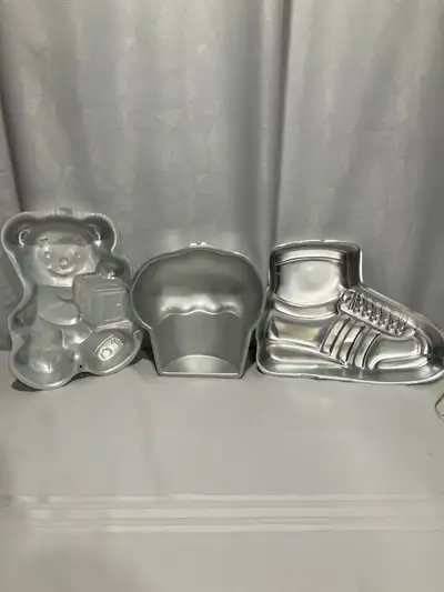 1995 Teddy Bear with Block mold;2005Cupcake mold; 1979 Superstar Shoe mold, all Wilton productions....