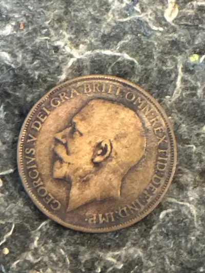 Here we have a 1912 One Penny coin featuring King George. Given its age, this coin shows signs of we...